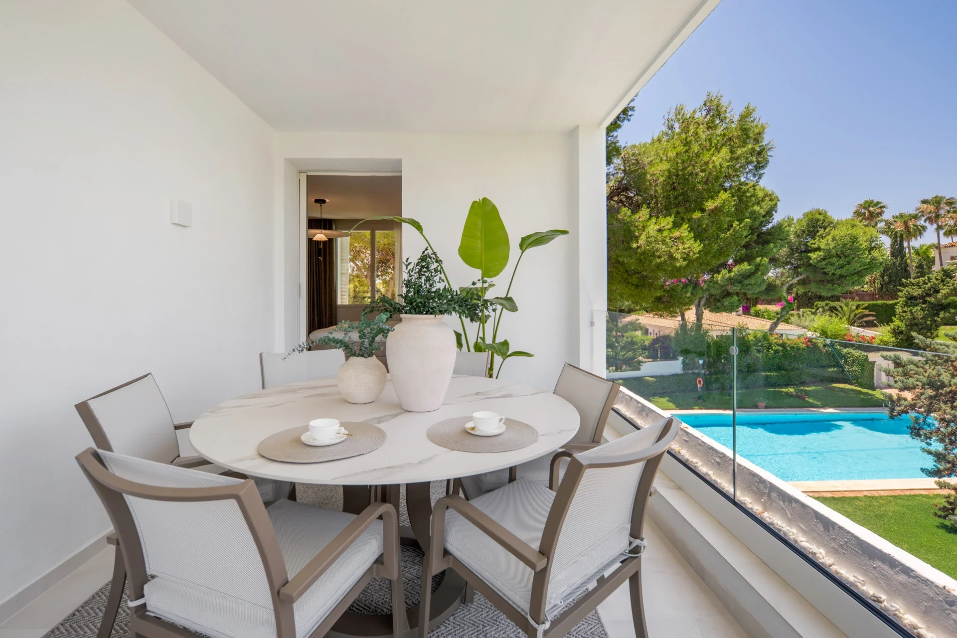 Dining terrace overlooking the communal pool