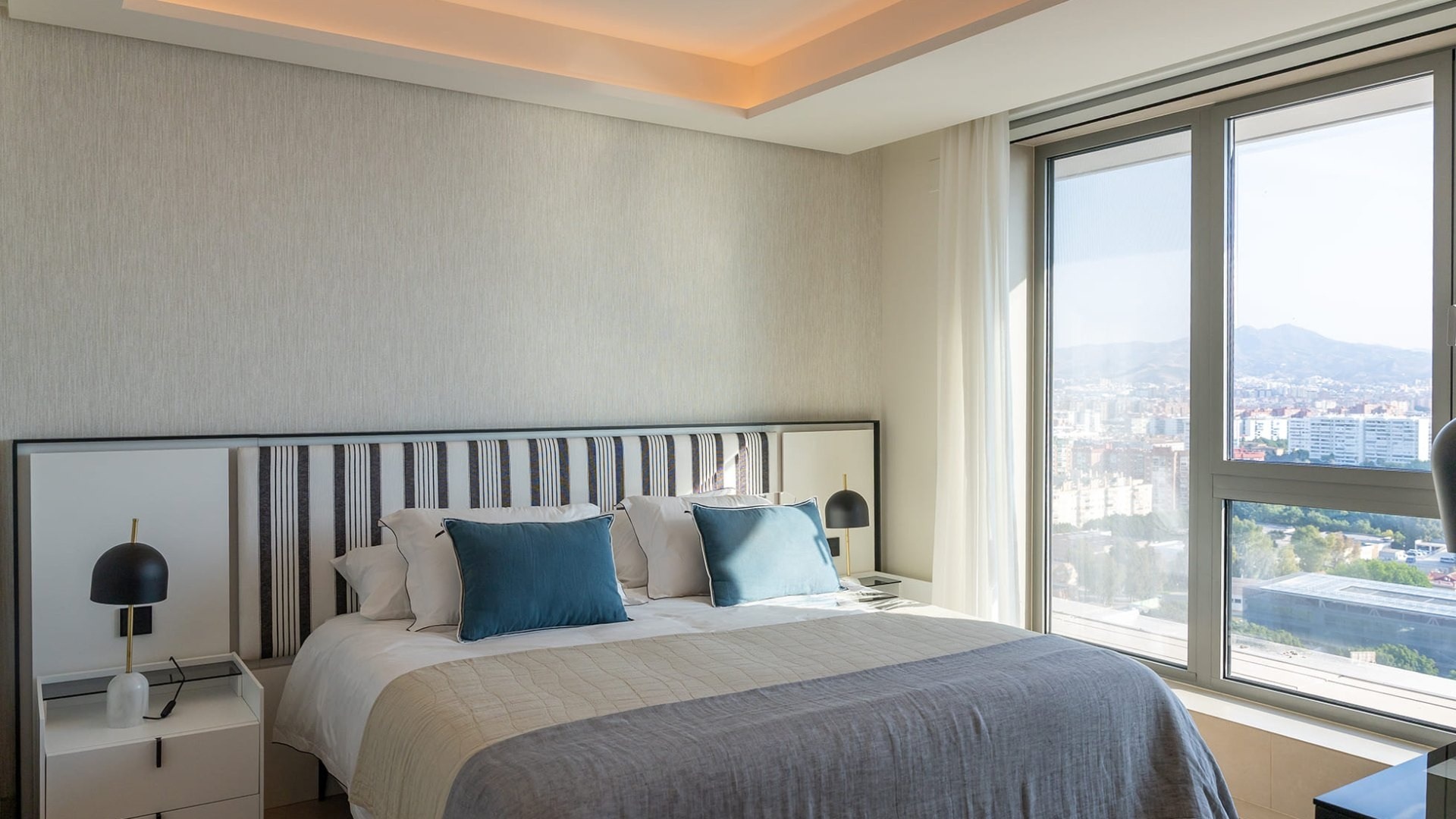 Representative penthouse bedroom with city views