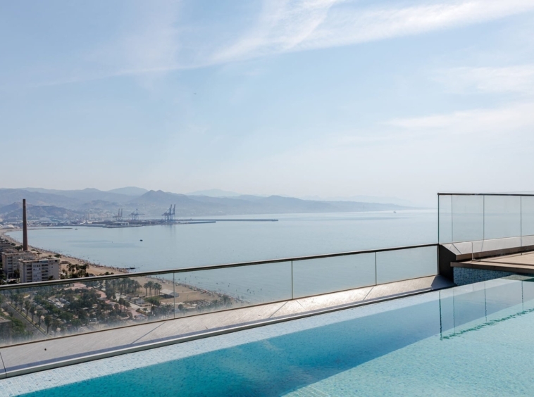 Representative rooftop swimming pool with views across Malaga bay