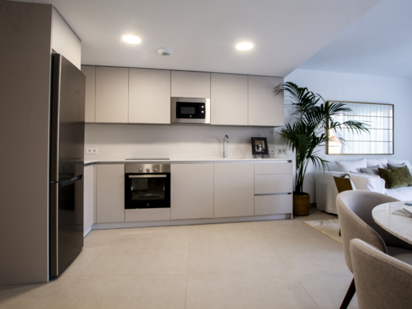 Fitted kitchen and living room in the representative show home