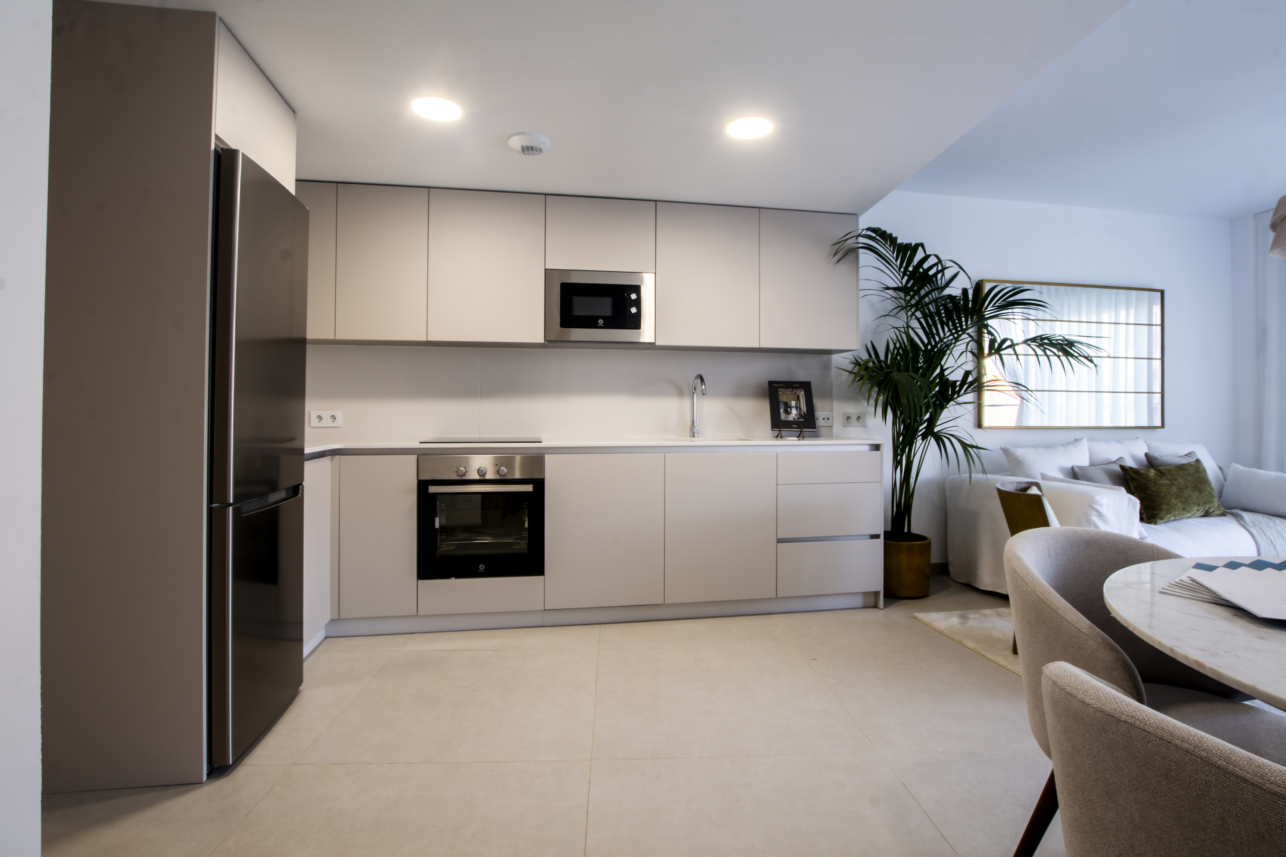 Fitted kitchen and living room in the representative show home