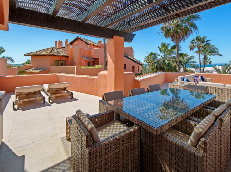 Covered outdoor dining area on the private terrace