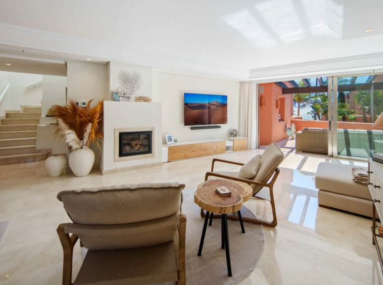 Living area with fireplace and staircase to the upper floor