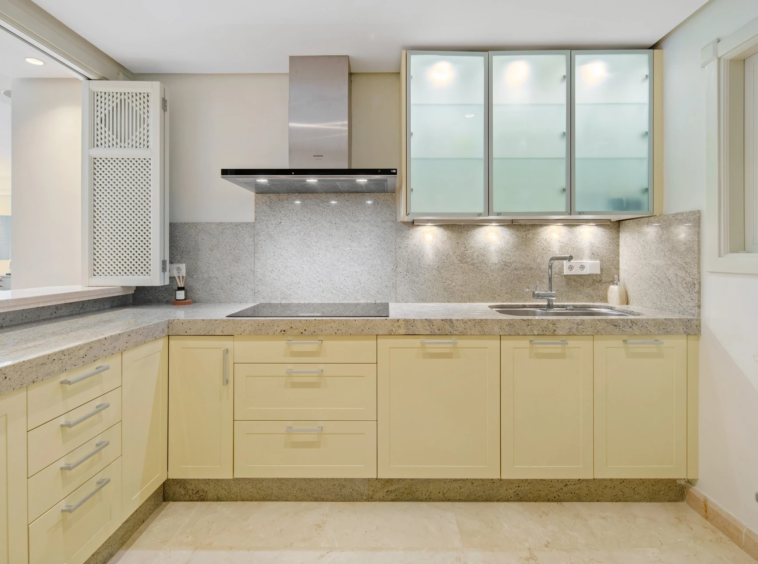 Fitted kitchen with stone worktops and integrated storage