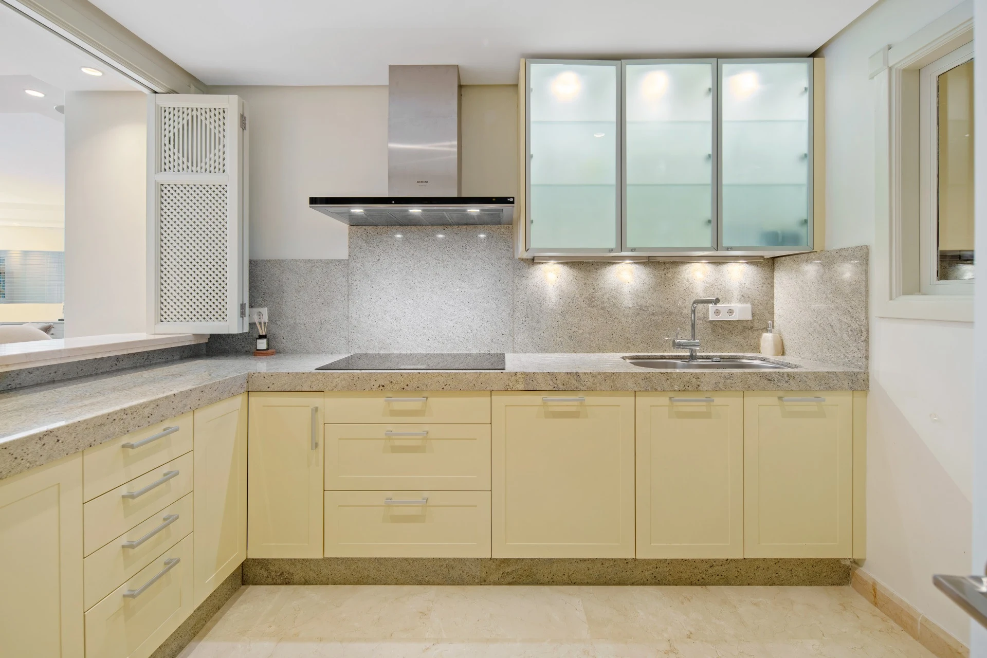 Fitted kitchen with stone worktops and integrated storage