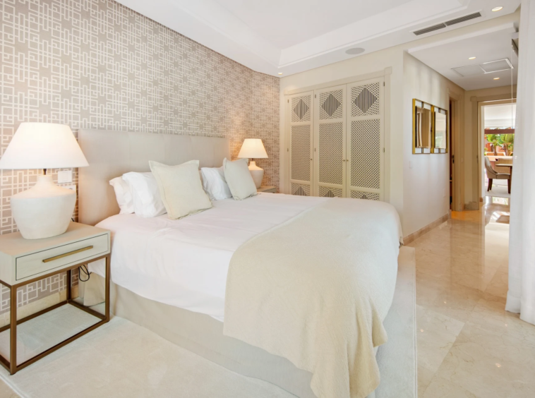 Guest bedroom with fitted wardrobes and soft neutral finishes
