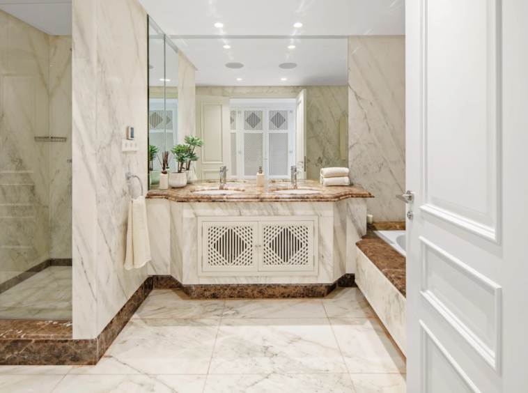 Marble bathroom with fitted vanity and walk-in shower