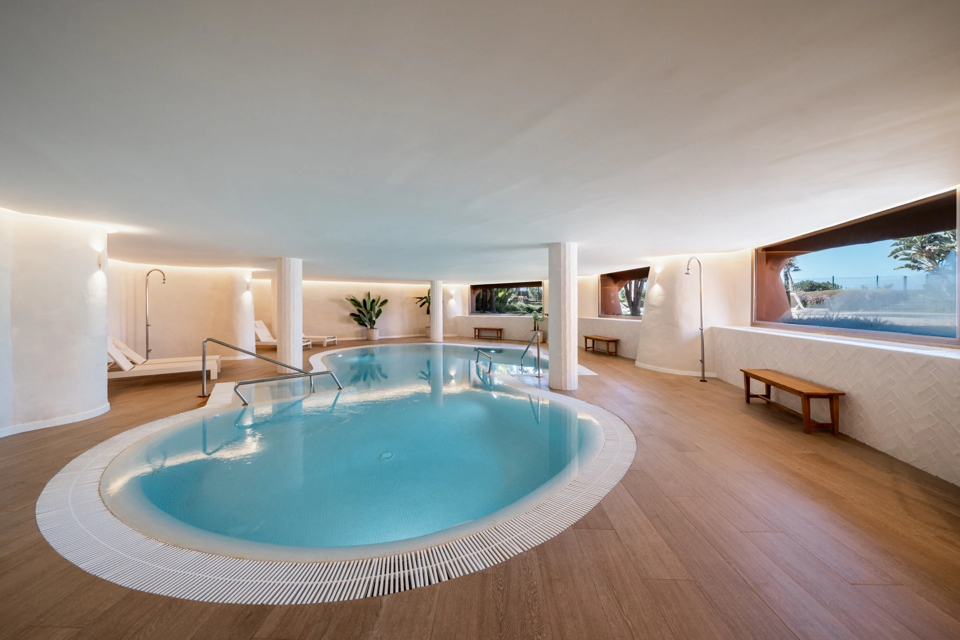 Communal indoor swimming pool with adjoining relaxation area