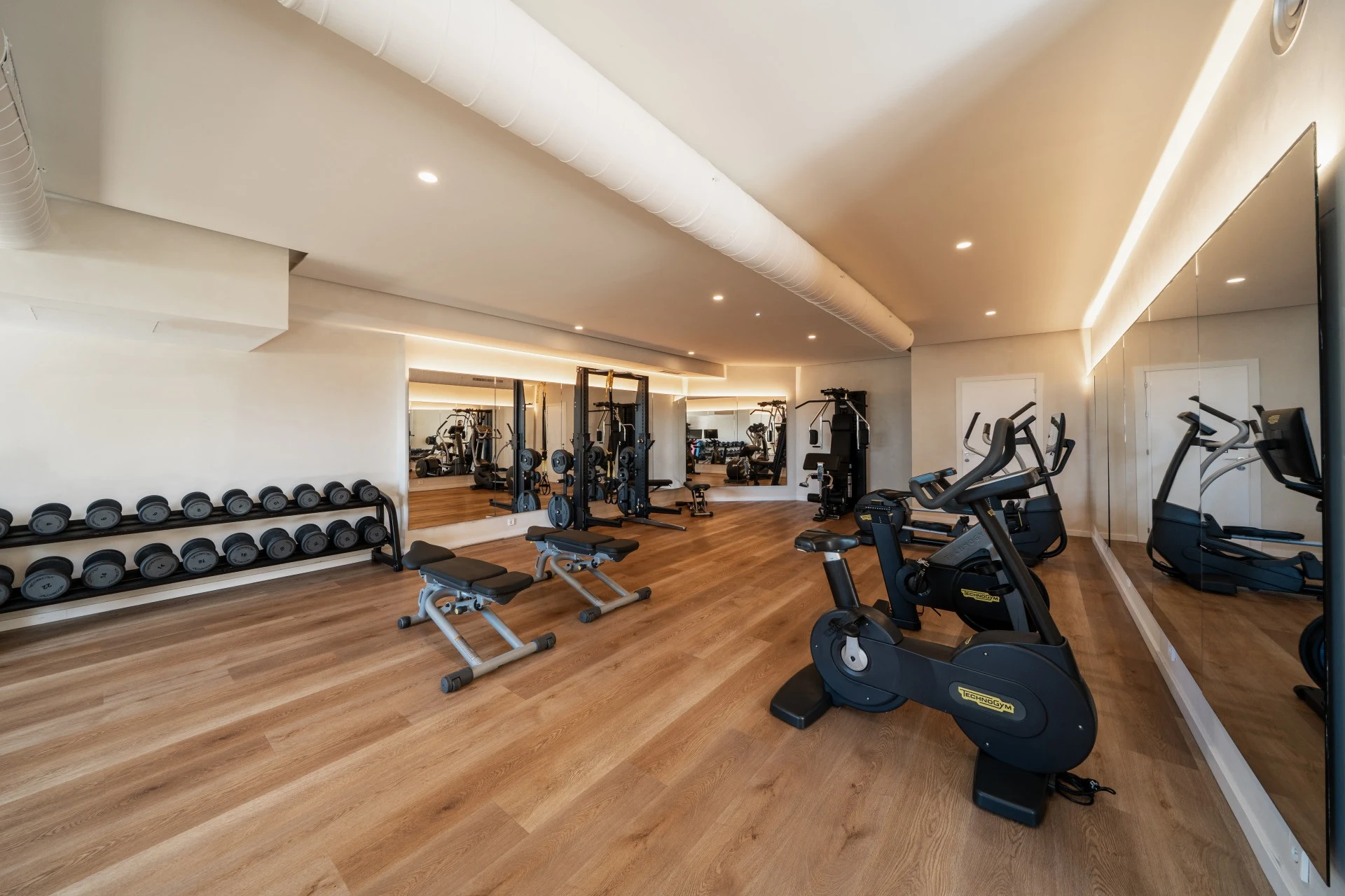 Community gym with cardio equipment and free weights