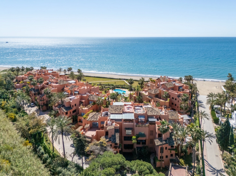 Beachfront community with shared gardens and swimming pools