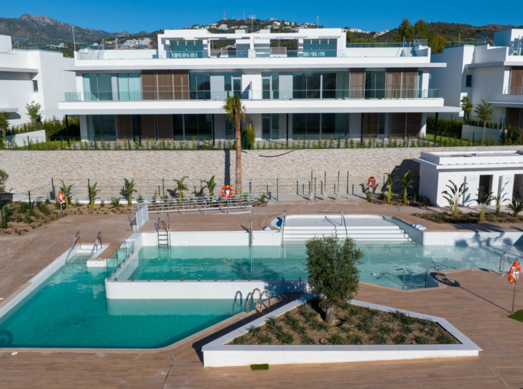 Communal pool beside completed residences in Marbella