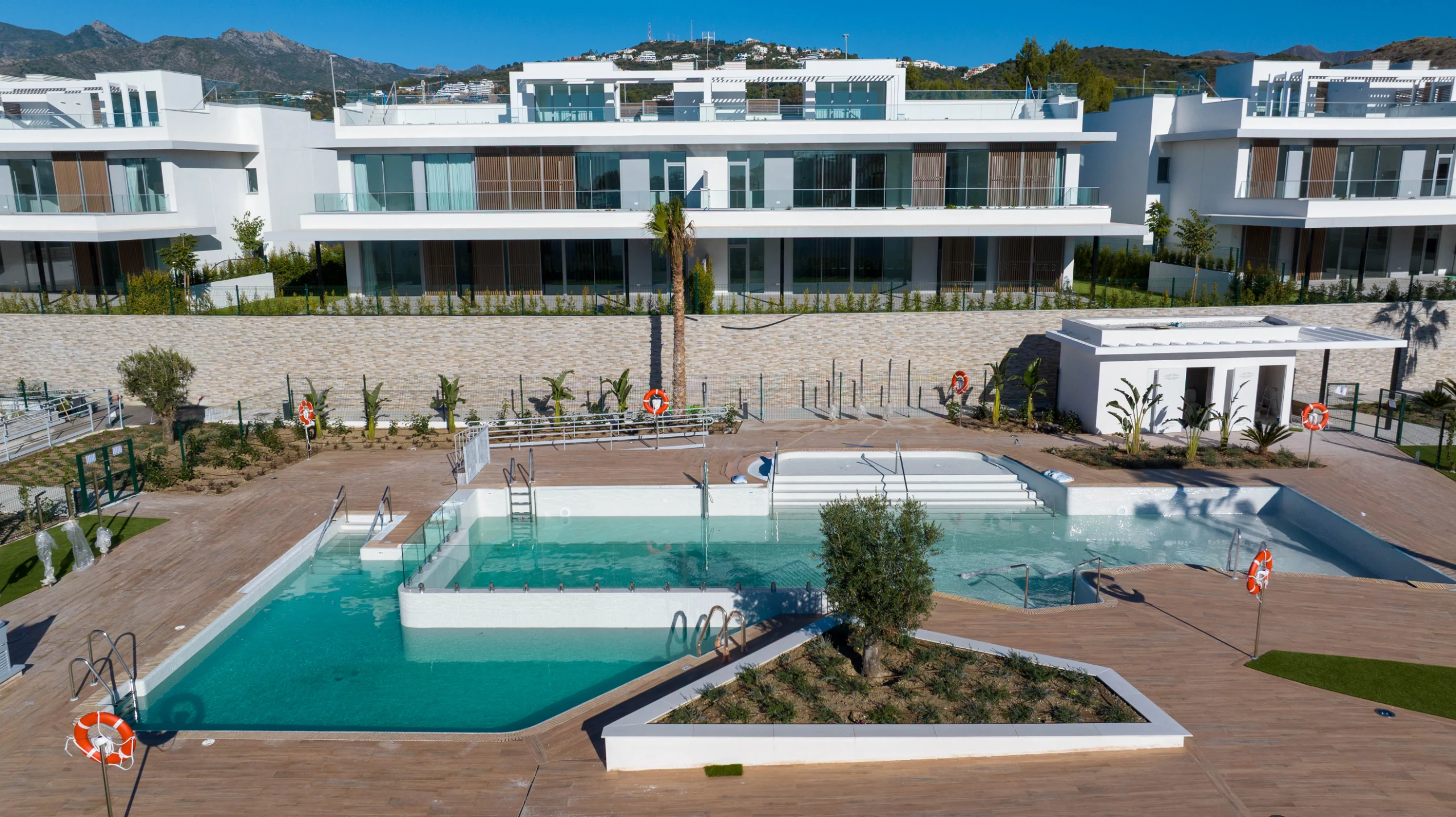Communal pool beside completed residences in Marbella