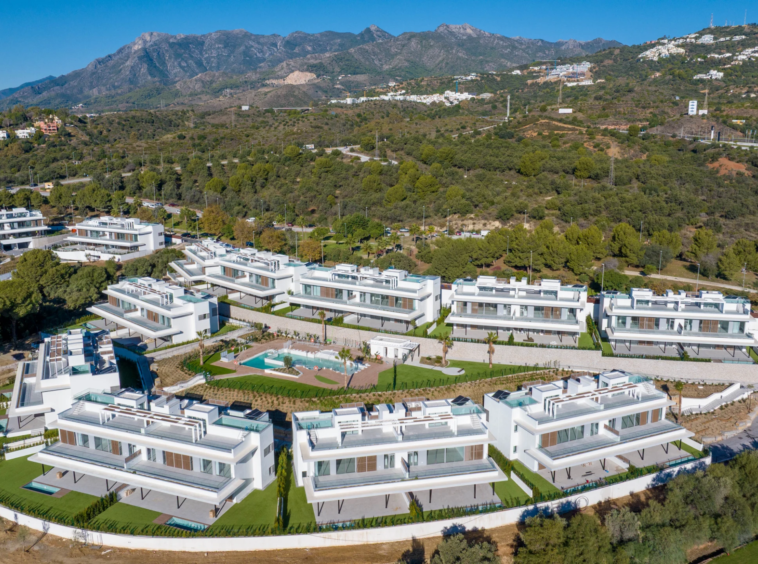 Completed residential buildings and surrounding hills in Marbella