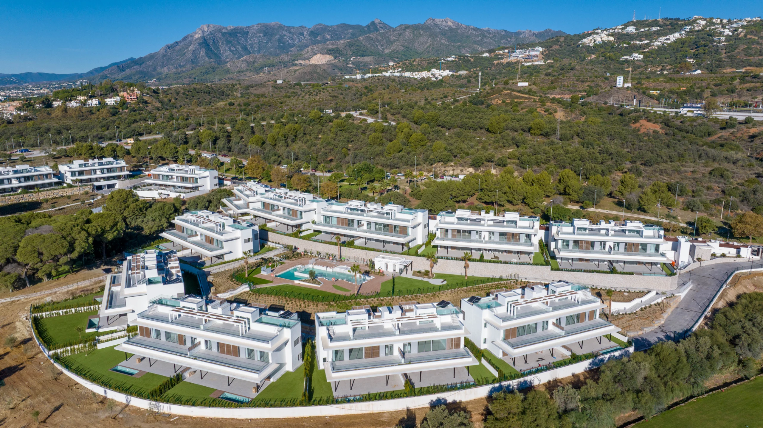 Completed residential buildings and surrounding hills in Marbella