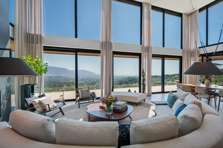 Double-height living room with floor-to-ceiling glazing in Marbella East