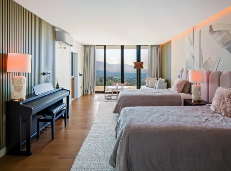 Bedroom opening onto a sea-view terrace in Marbella East