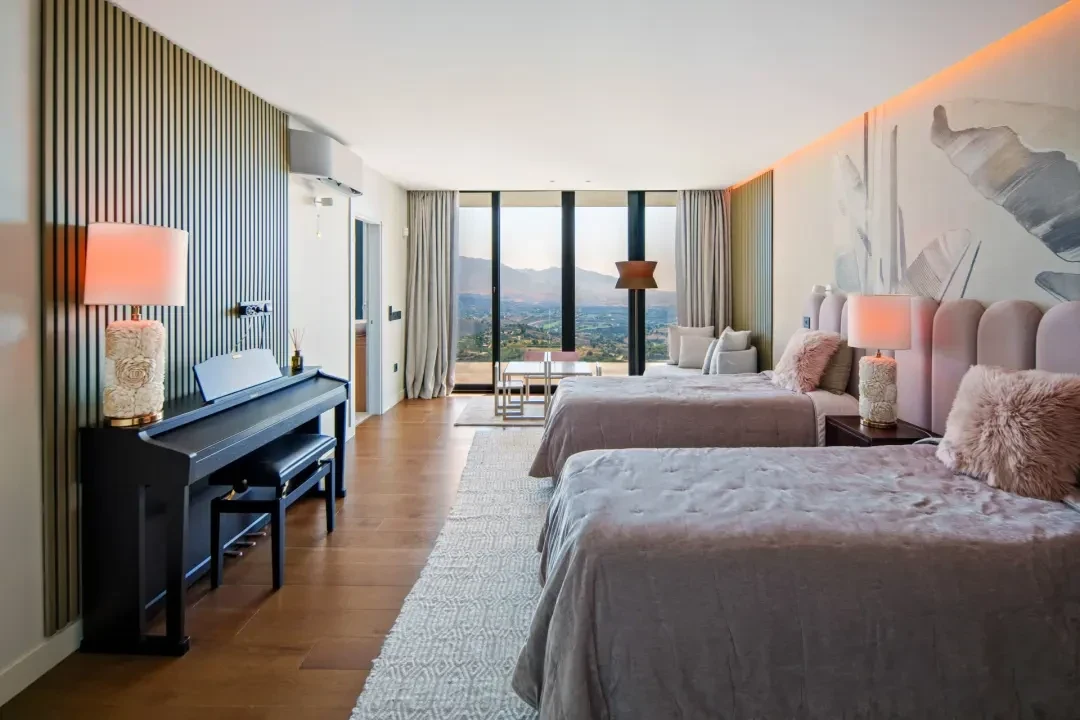 Bedroom opening onto a sea-view terrace in Marbella East