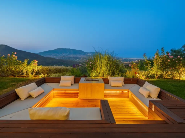 Sunken outdoor fire-pit lounge at dusk in Marbella East