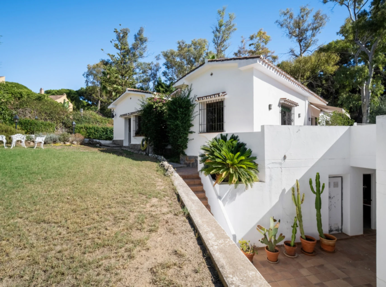 Garden and white villa exterior