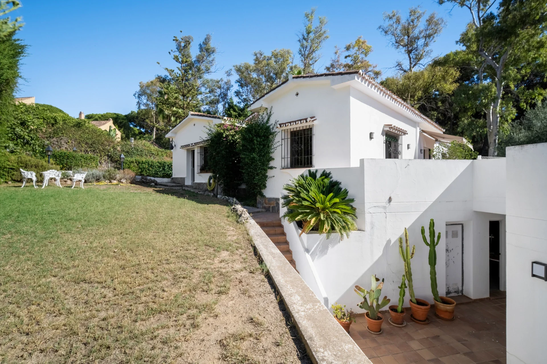 Garden and white villa exterior