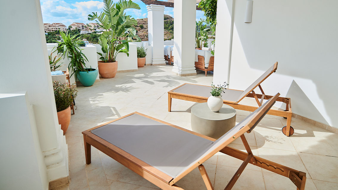 Sunny terrace with lounge chairs
