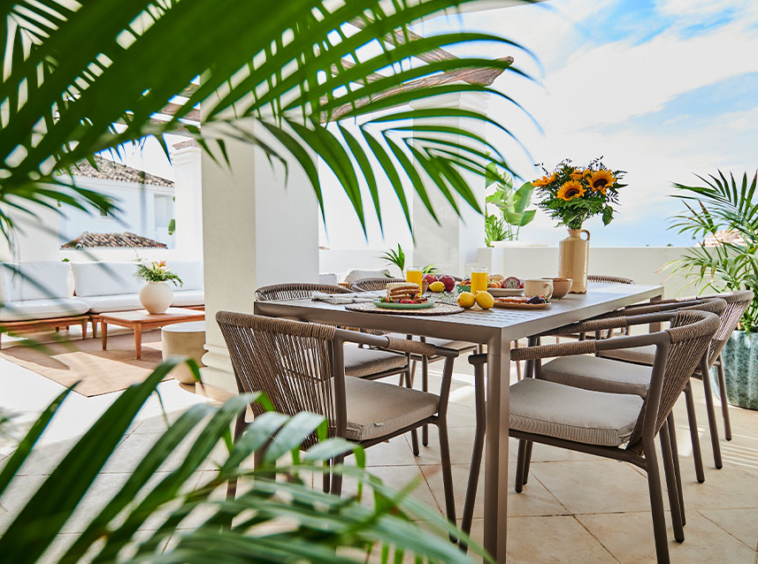 Outdoor dining area in a representative apartment