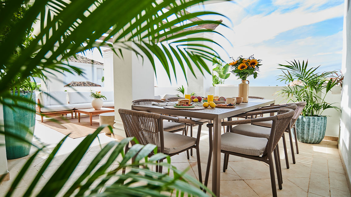 Outdoor dining area in a representative apartment