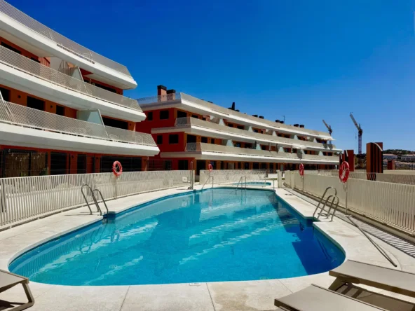 Communal swimming pool beside apartments in Mijas