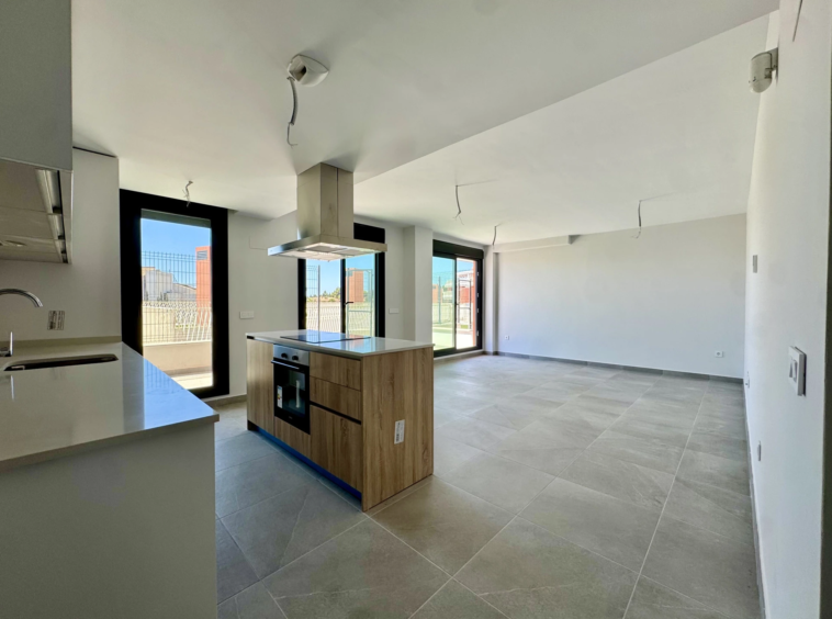 Open-plan kitchen and living area before furnishing