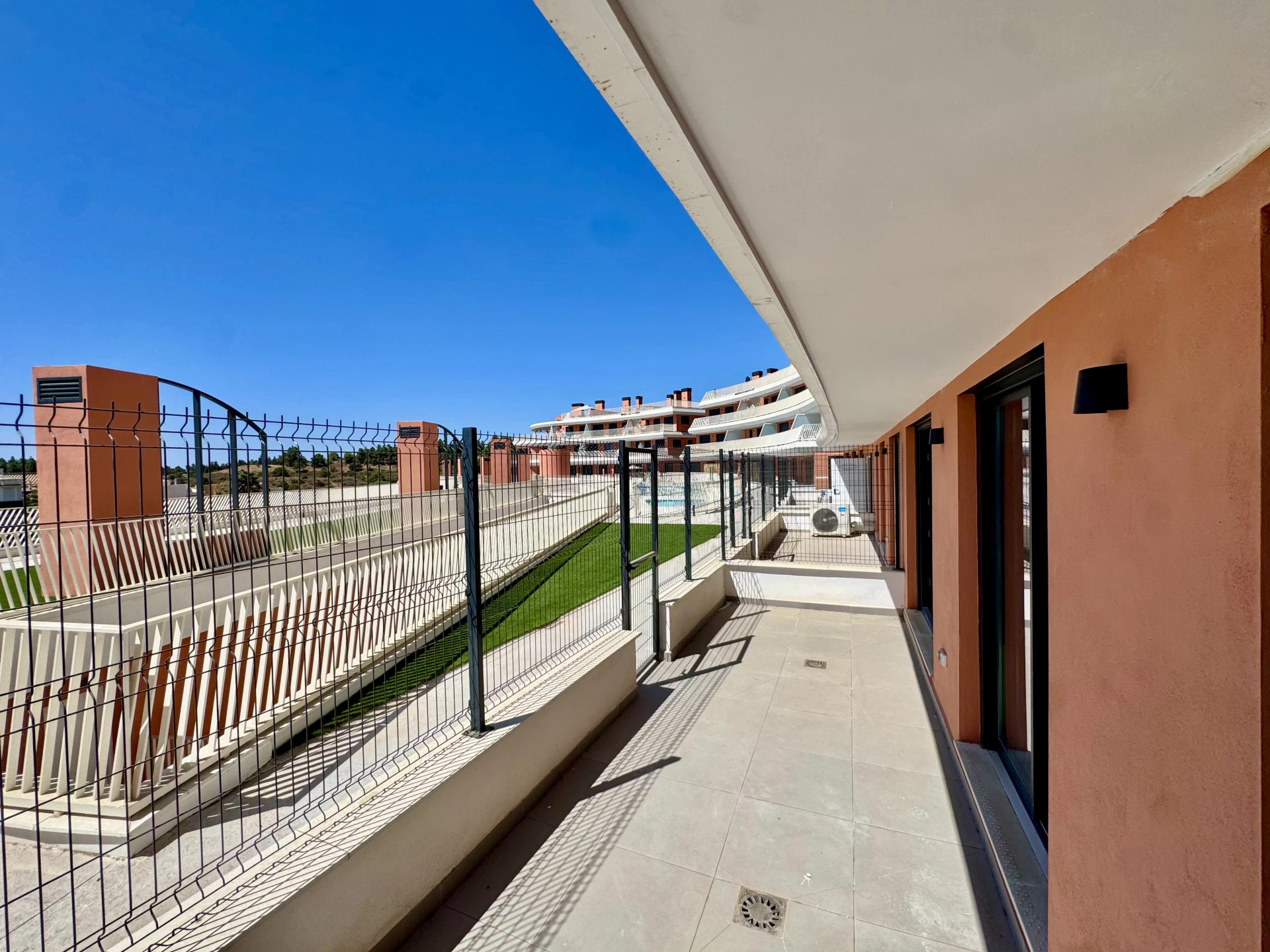 Covered terrace of a three-bedroom apartment