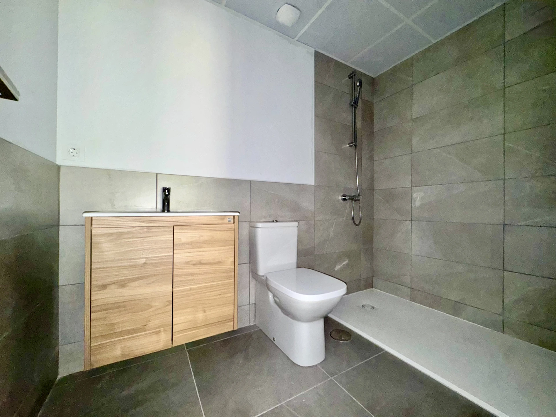 Bathroom with shower and vanity