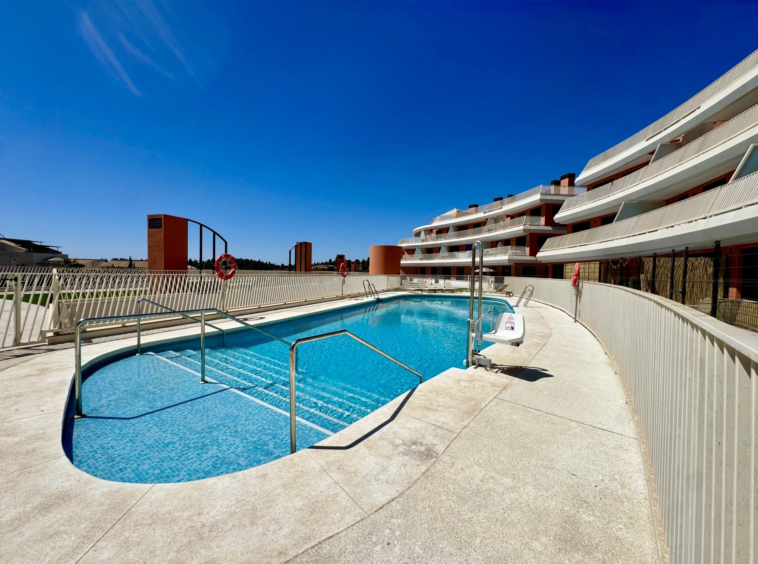 Communal pool and landscaped residential setting