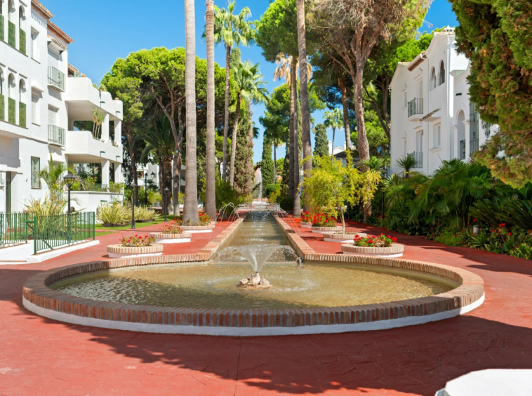 Communal courtyard with fountains and mature planting
