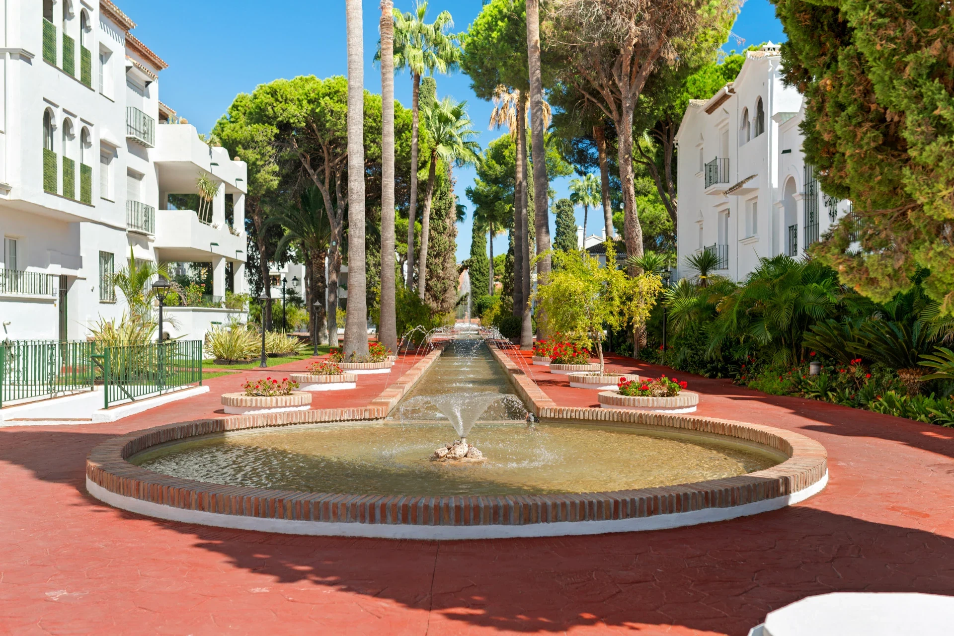 Communal courtyard with fountains and mature planting