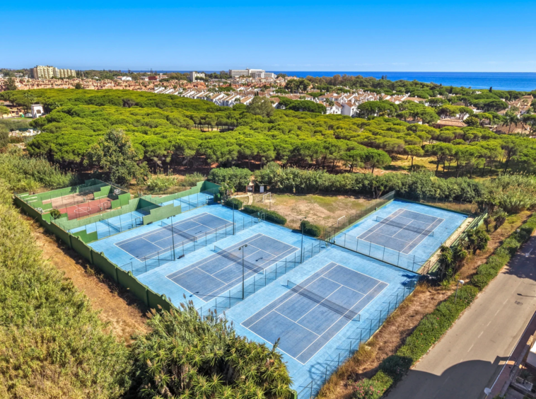Tennis courts within the residential surroundings