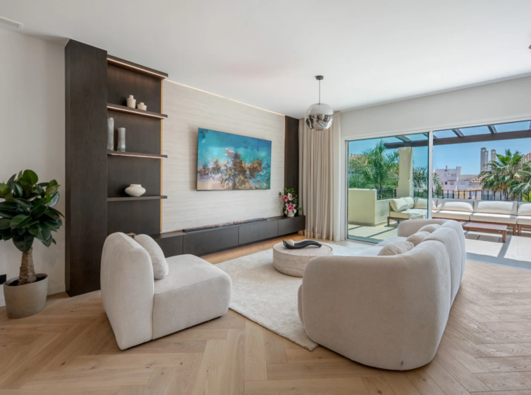 Open-plan living room opening onto the terrace