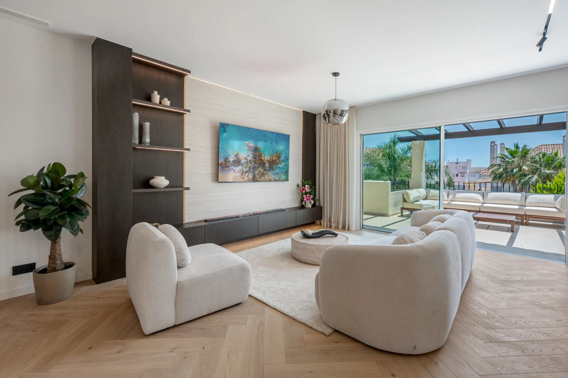 Open-plan living room opening onto the terrace