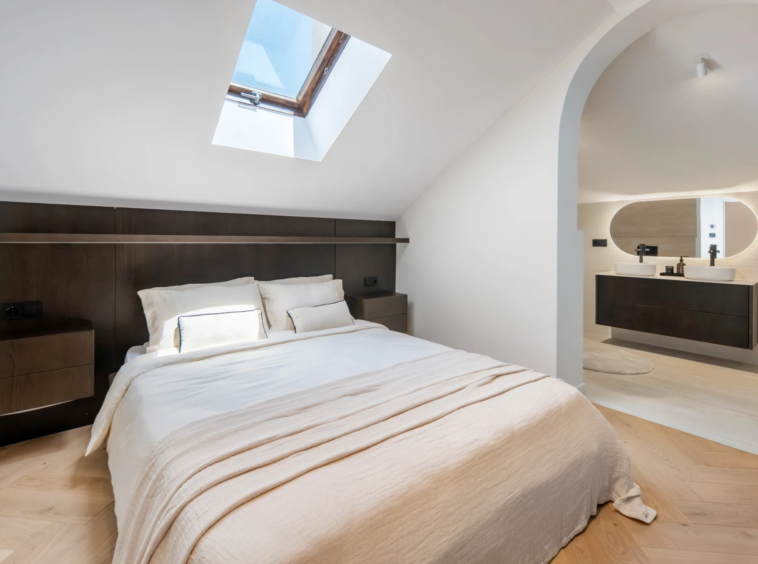 Second bedroom with a skylight