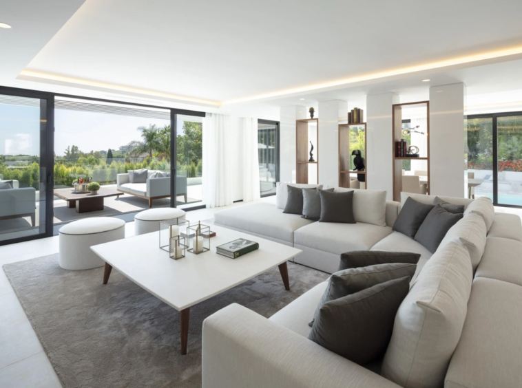 Bright living room opening onto the poolside terrace