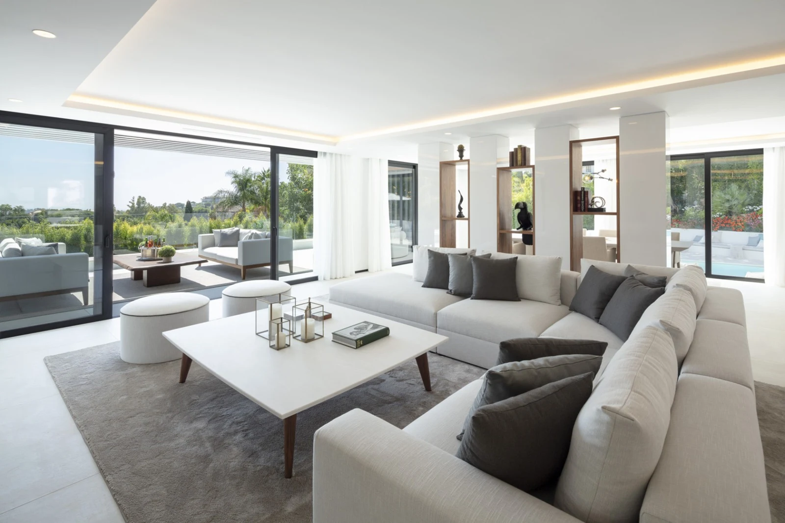 Bright living room opening onto the poolside terrace