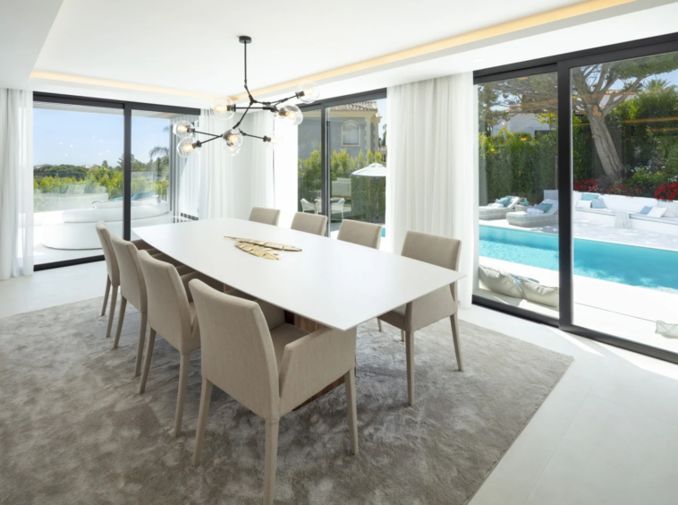 Dining area beside sliding doors to the pool terrace
