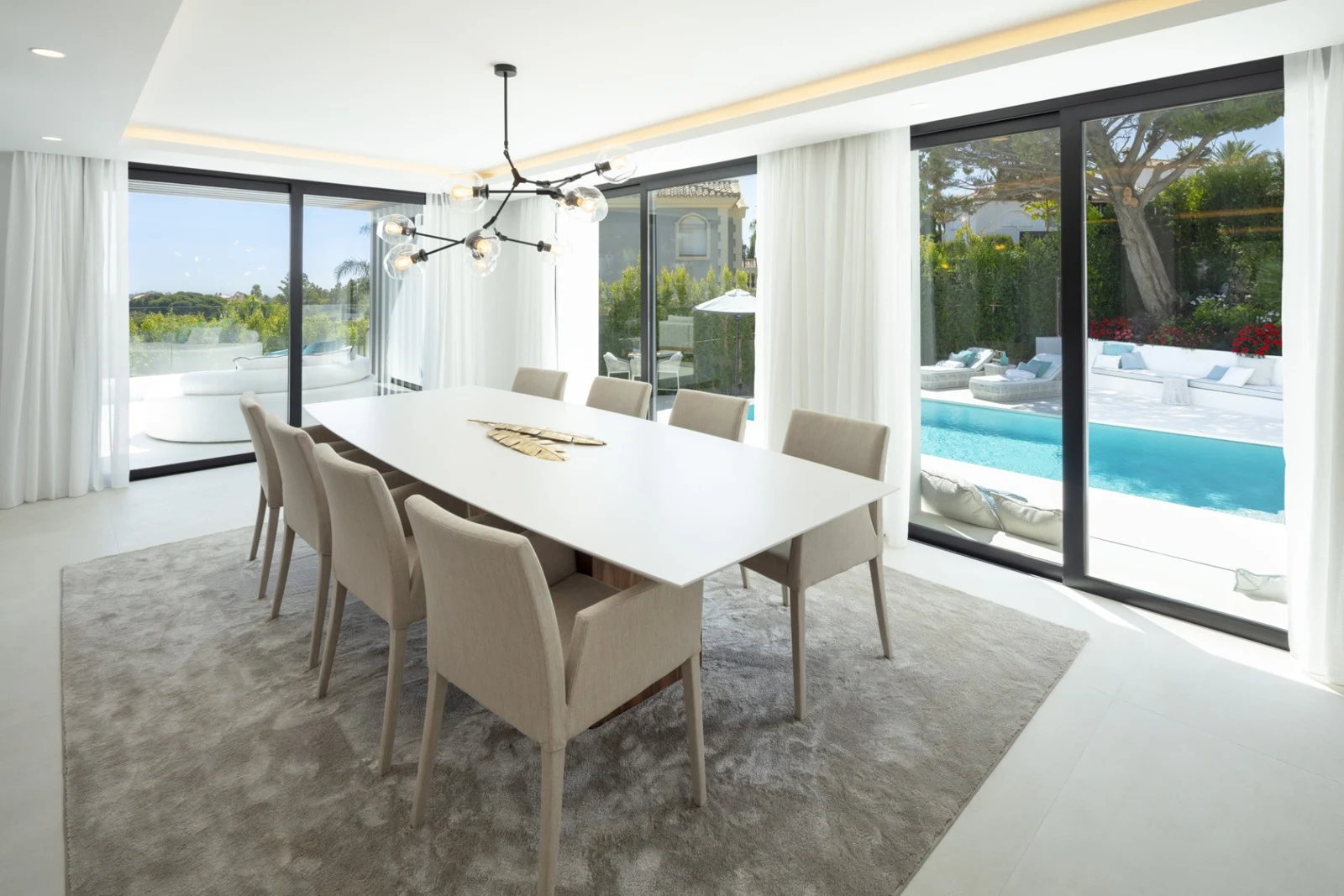 Dining area beside sliding doors to the pool terrace