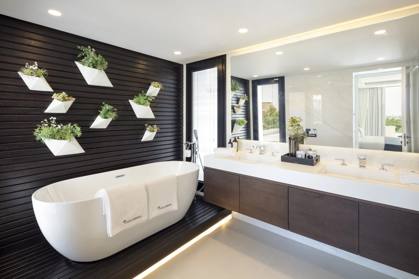 Principal bathroom with freestanding bathtub and vanity