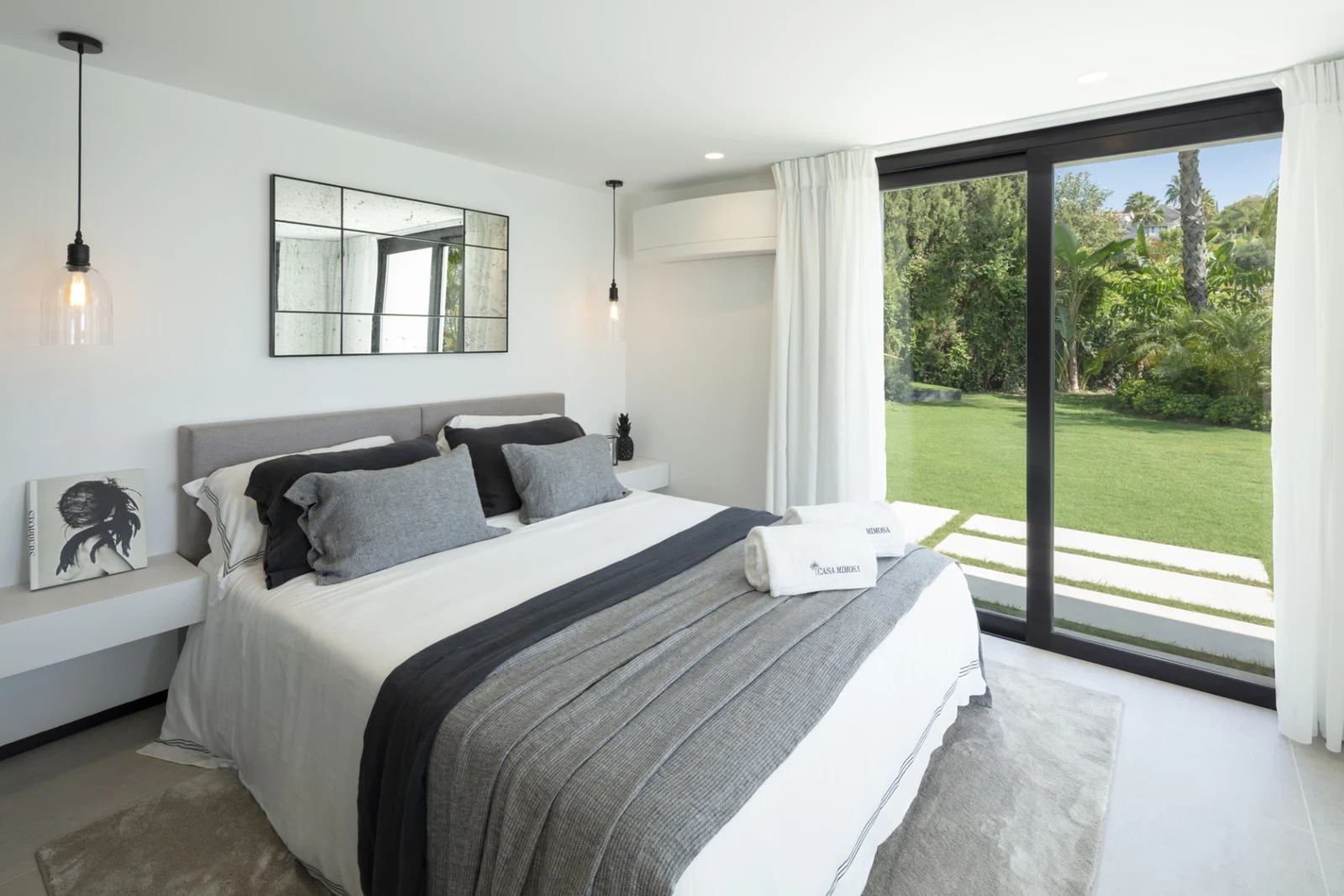 Guest bedroom with access to landscaped outdoor space