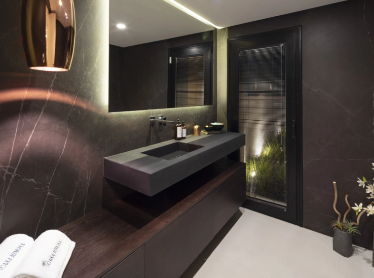 Guest bathroom with dark stone finishes