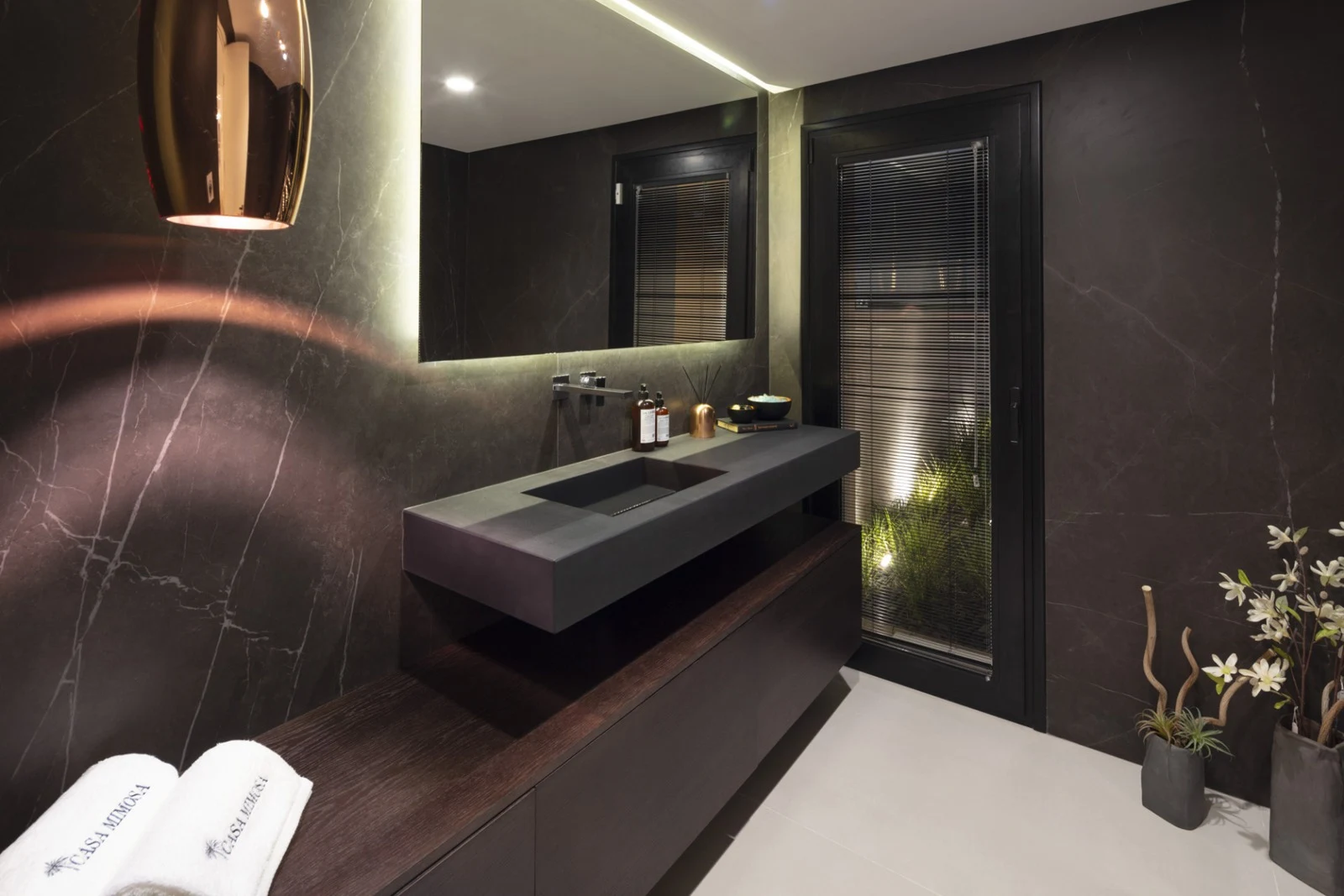 Guest bathroom with dark stone finishes