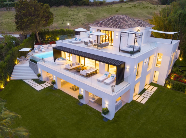 Villa and terraces illuminated in the evening