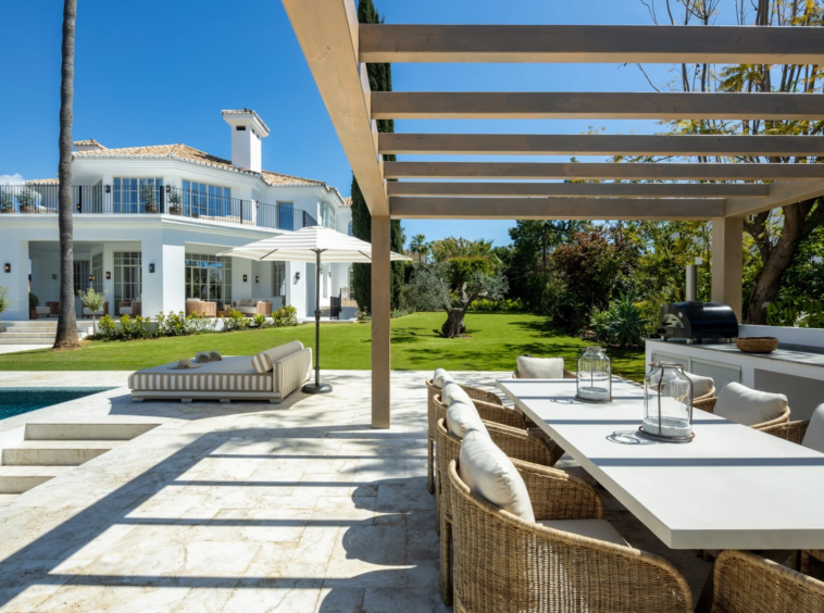 Shaded outdoor dining terrace beside the private swimming pool