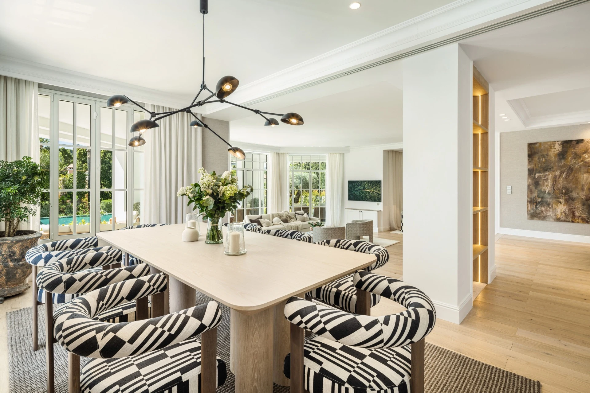 Dining area with large windows and contemporary furnishings