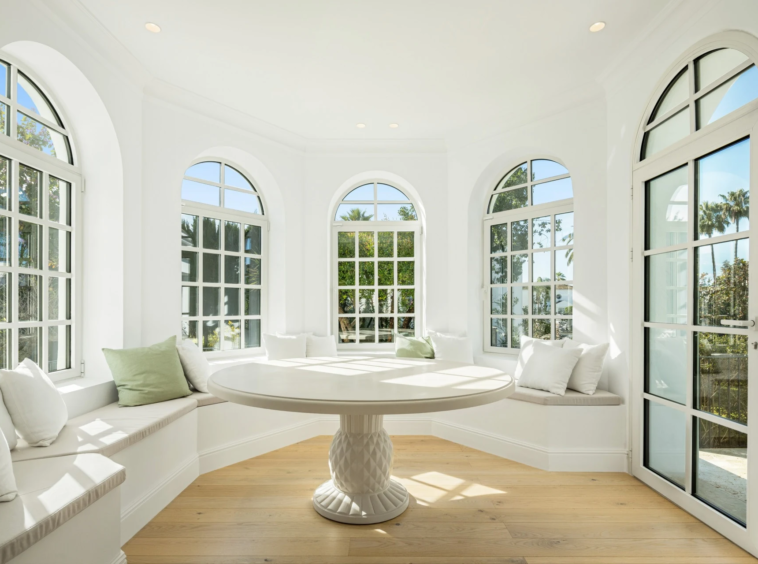 Circular sitting room with tall arched windows